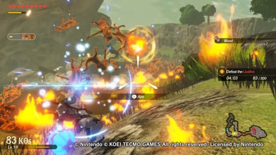 A red barrel explosion eliminating Lizalfos in Hyrule Warriors. - Hyrule Warriors: Age of Calamity