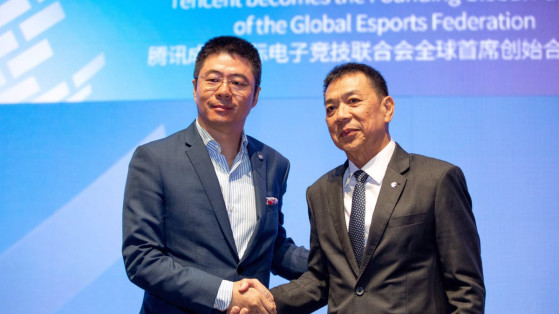 On the left, Tencent Vice President Edward Cheng shakes hands with Chris Chan, President of the Global Esport Federation. - Millenium